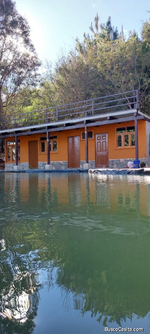 VENTARENTA Terreno con construcción camino a Santa Rosa de Lima