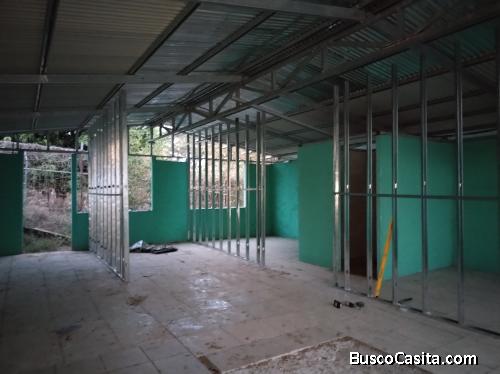 Terreno con casa en construcción 