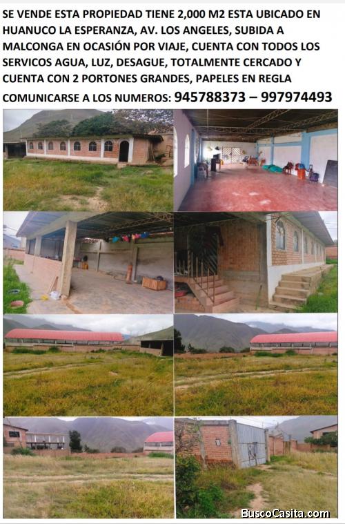 Terreno cercado con local para recreo o almacén.
