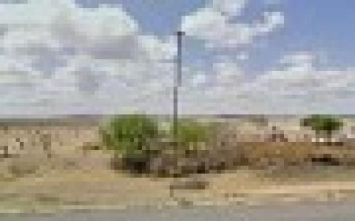 Terreno a un lado de la carretera 57 con servicios