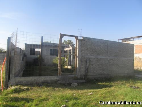 terreno con pie de casa