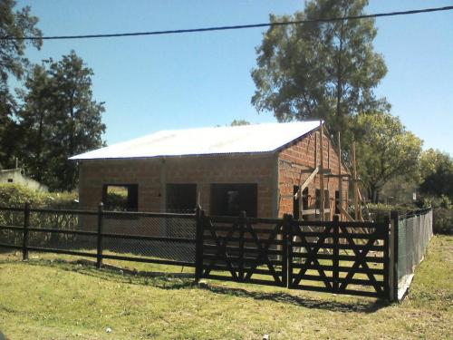 TERRENO CON CASA A TERMINAR, RINCON DE TORTUGUITAS