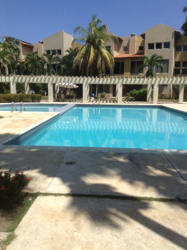 DOMUS REALTIES C.A ALQUILA APTO EN PUERTO AVENTURA LECHERIA