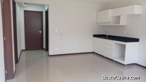 departamento con cosina amoblada, dos dormitorios, un baño con termo calefon, un estacionamiento  