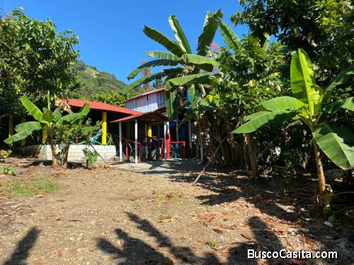 FINCA DE 38 TAREAS CON RIO DE VENTA EN BONAO
